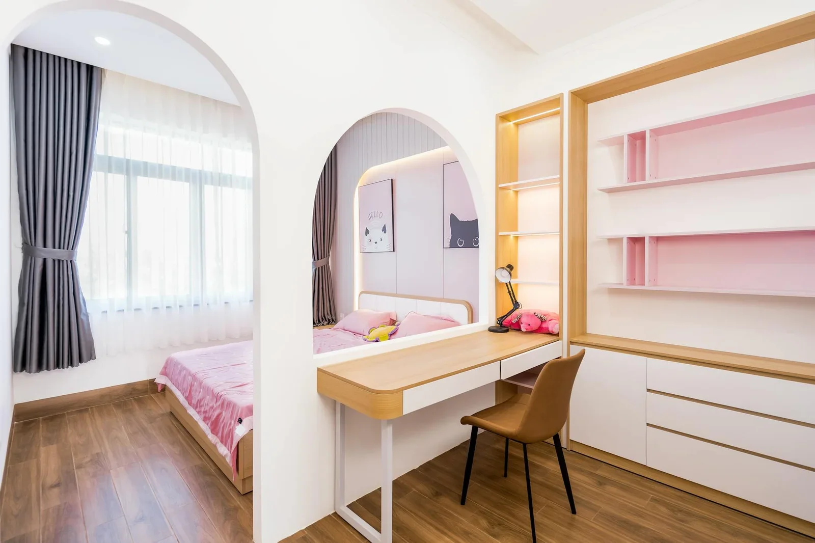 Bright, modern bedroom featuring a stylish pink workspace an | Thiết kế nội thất 24