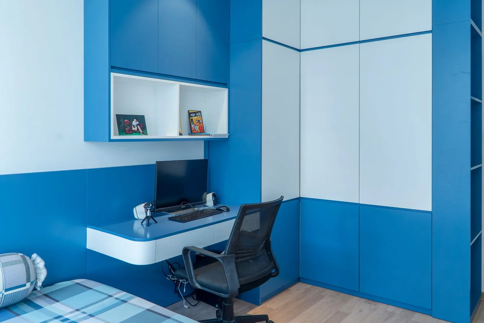 Stylish bedroom interior with blue decor, desk setup, and co | Thiết kế nội thất 24