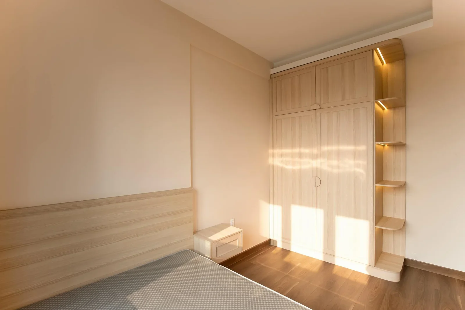 Cozy empty bedroom featuring wooden furniture and warm light | Thiết kế nội thất 24