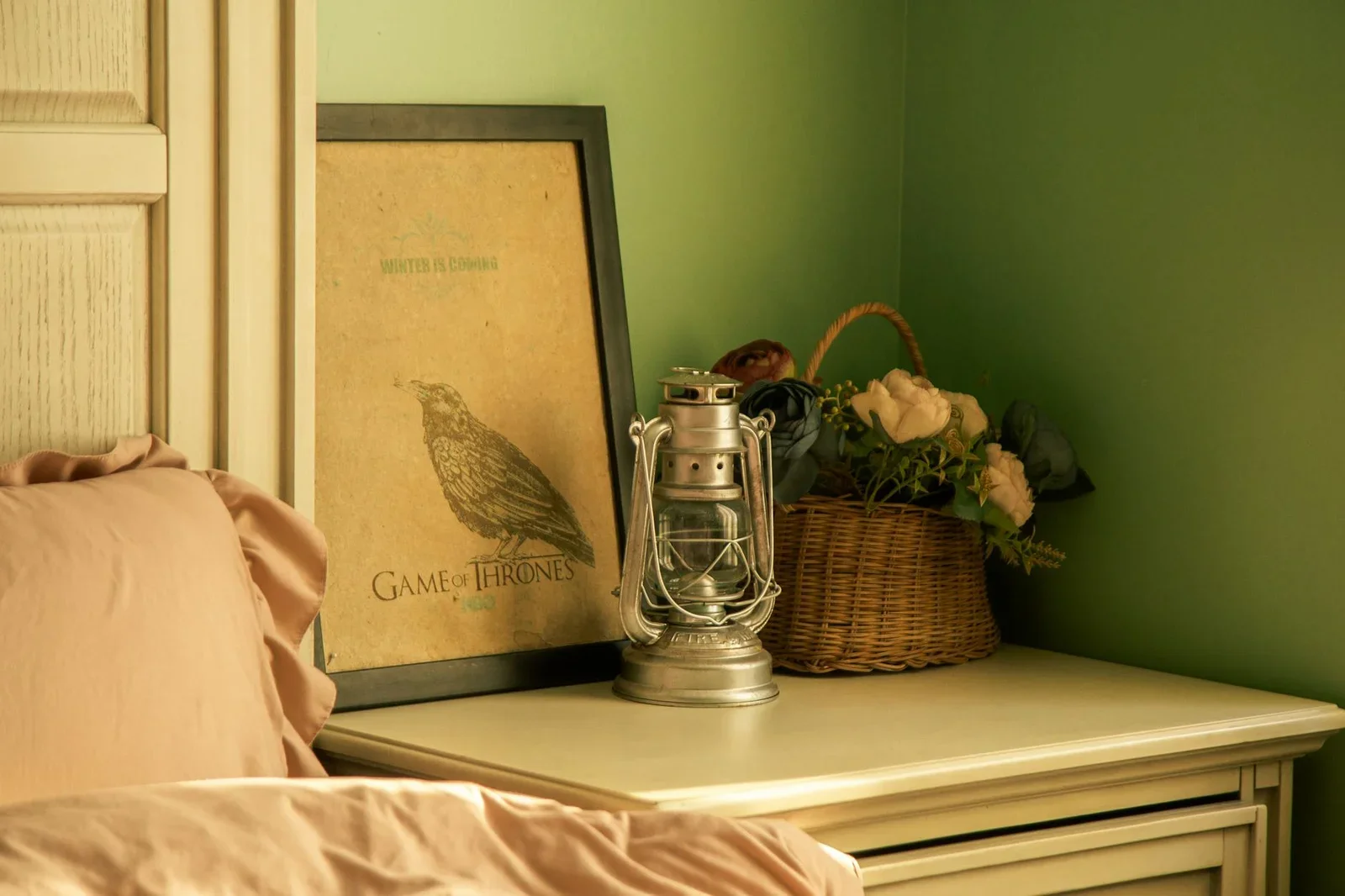 Warmly lit bedroom corner with poster, lantern, and floral b | Thiết kế nội thất 24