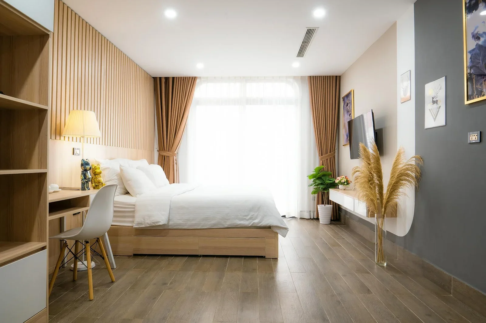A modern minimalist bedroom with natural light, featuring co | Thiết kế nội thất 24