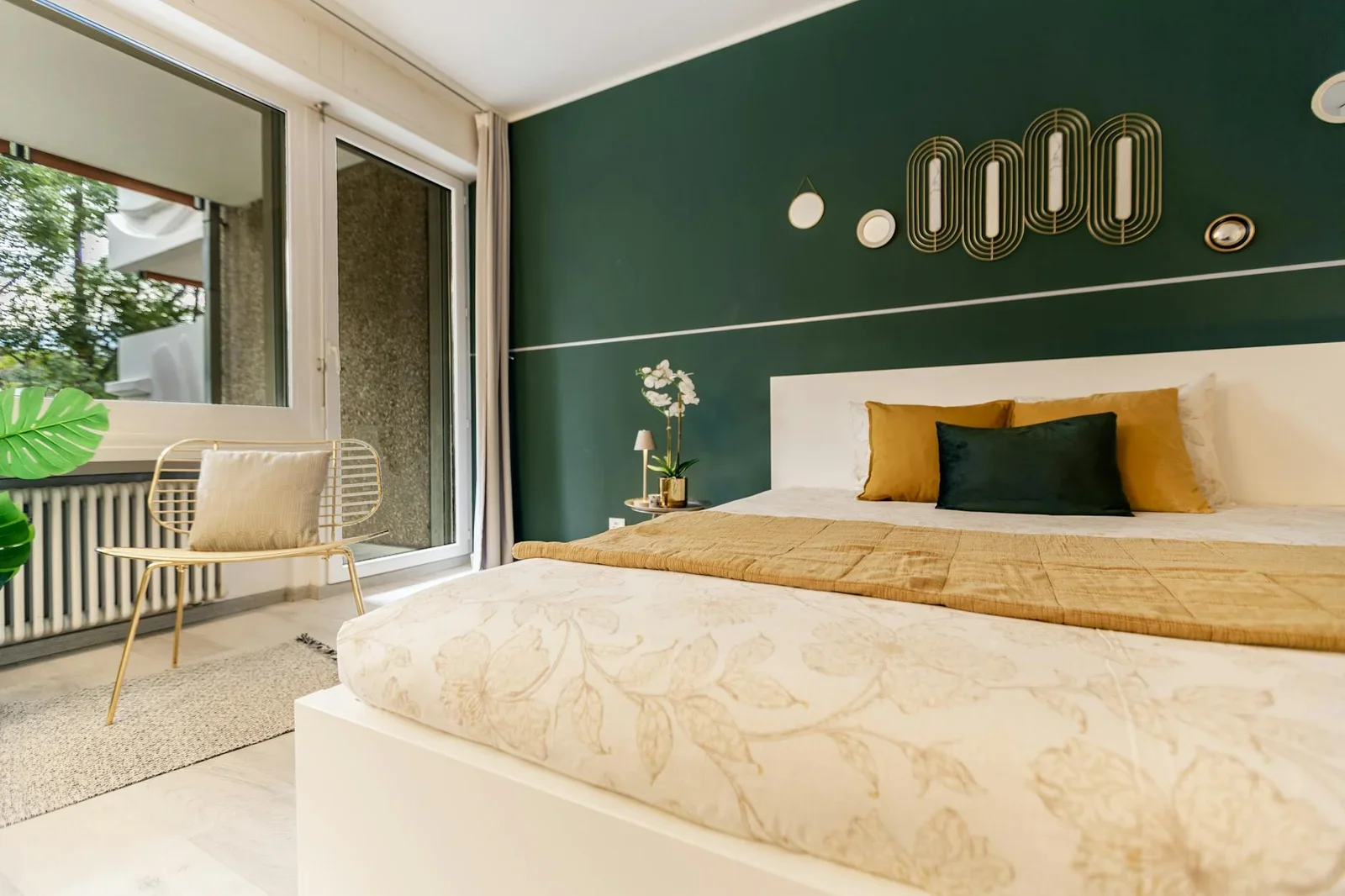 Stylish bedroom featuring a green accent wall, cozy bed, and | Thiết kế nội thất 24
