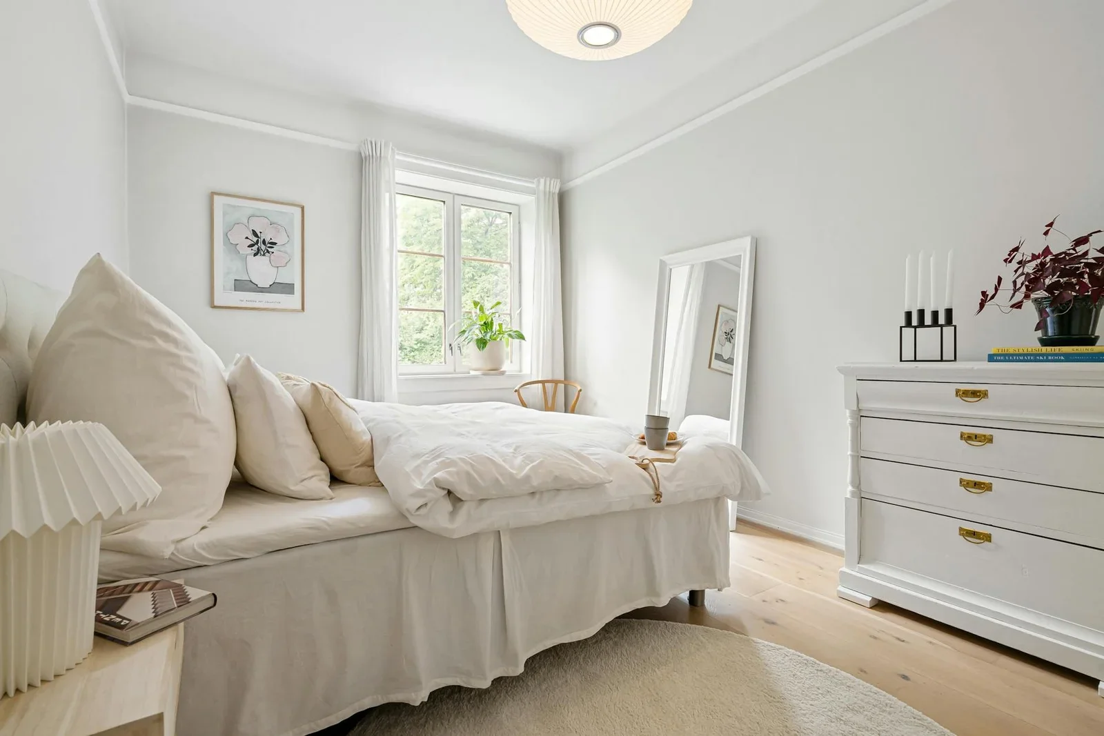 Elegant minimalist bedroom with white bedding, plants, and n | Thiết kế nội thất 24
