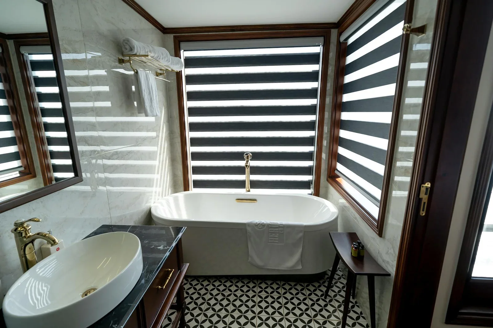 Elegant bathroom interior featuring a freestanding bathtub,  | Thiết kế nội thất 24