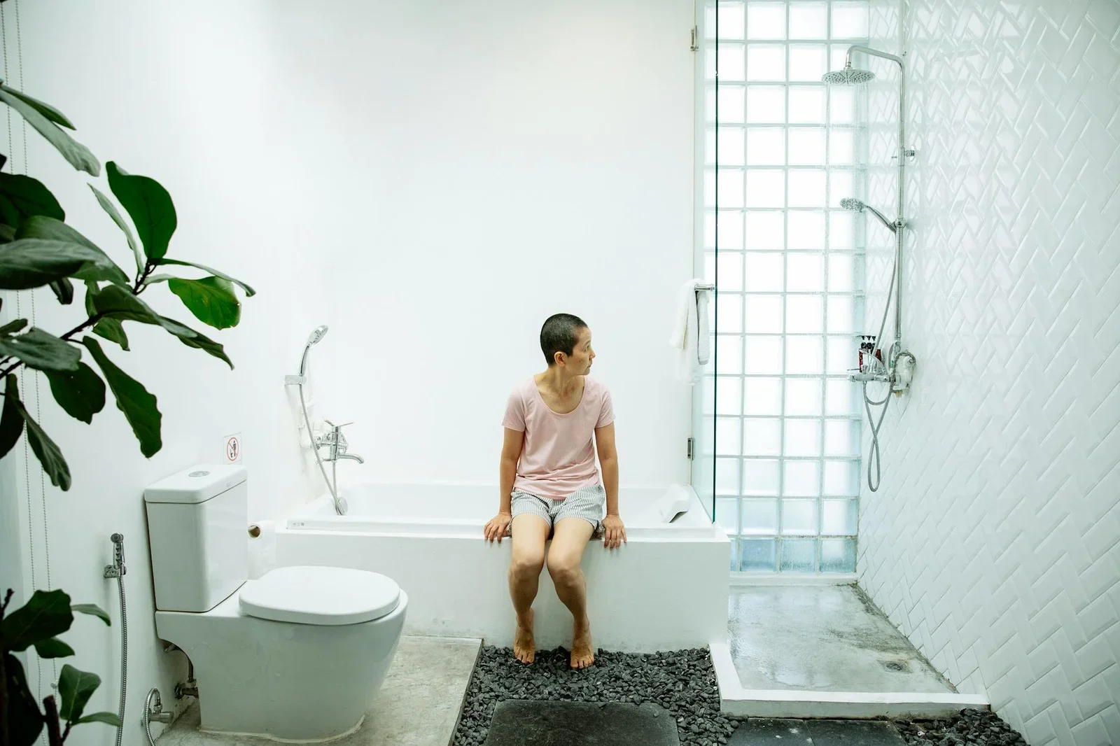 Full body of barefoot female in casual clothes sitting on ba | Thiết kế nội thất 24