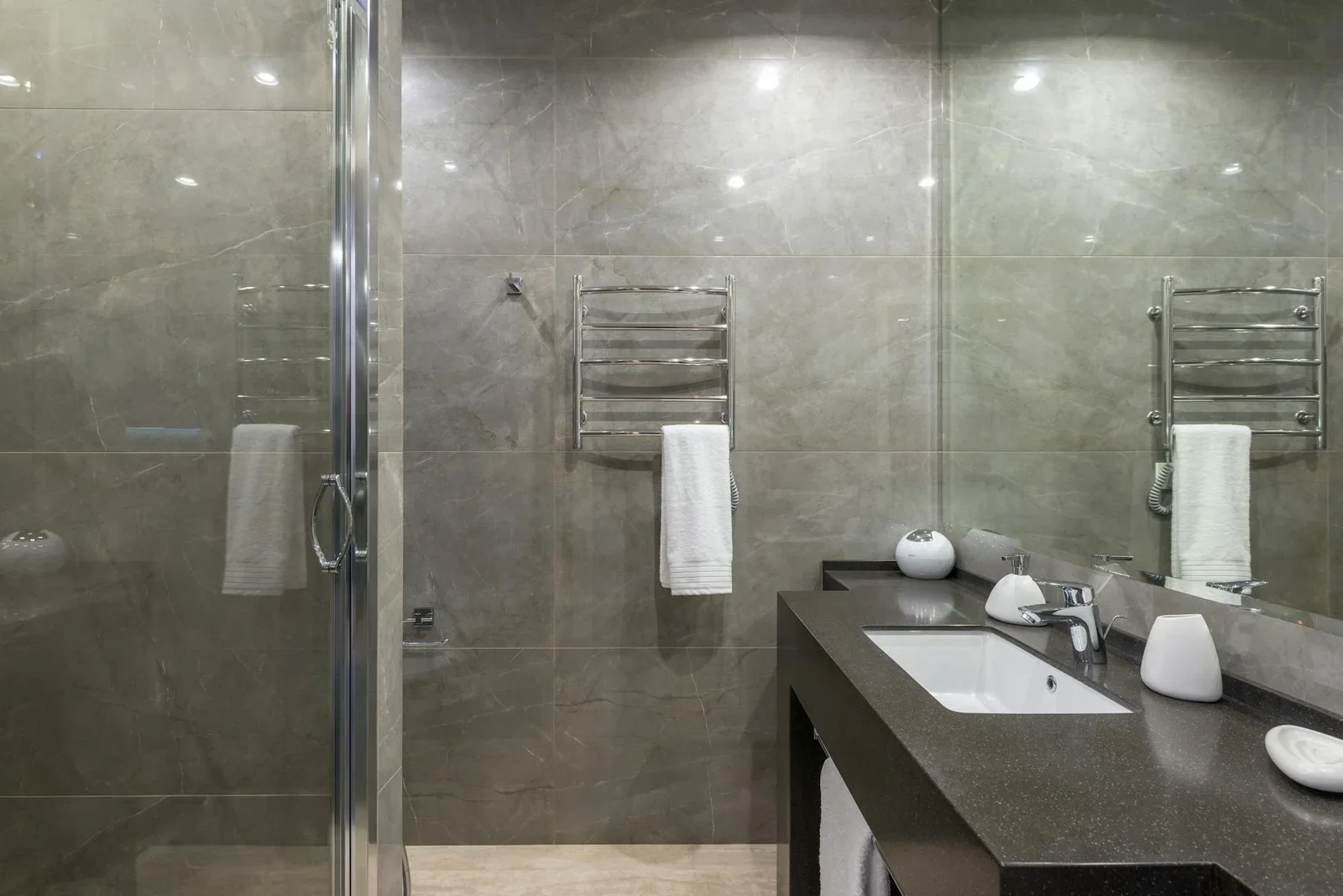 Interior of modern minimalist bathroom with glass shower cab | Thiết kế nội thất 24