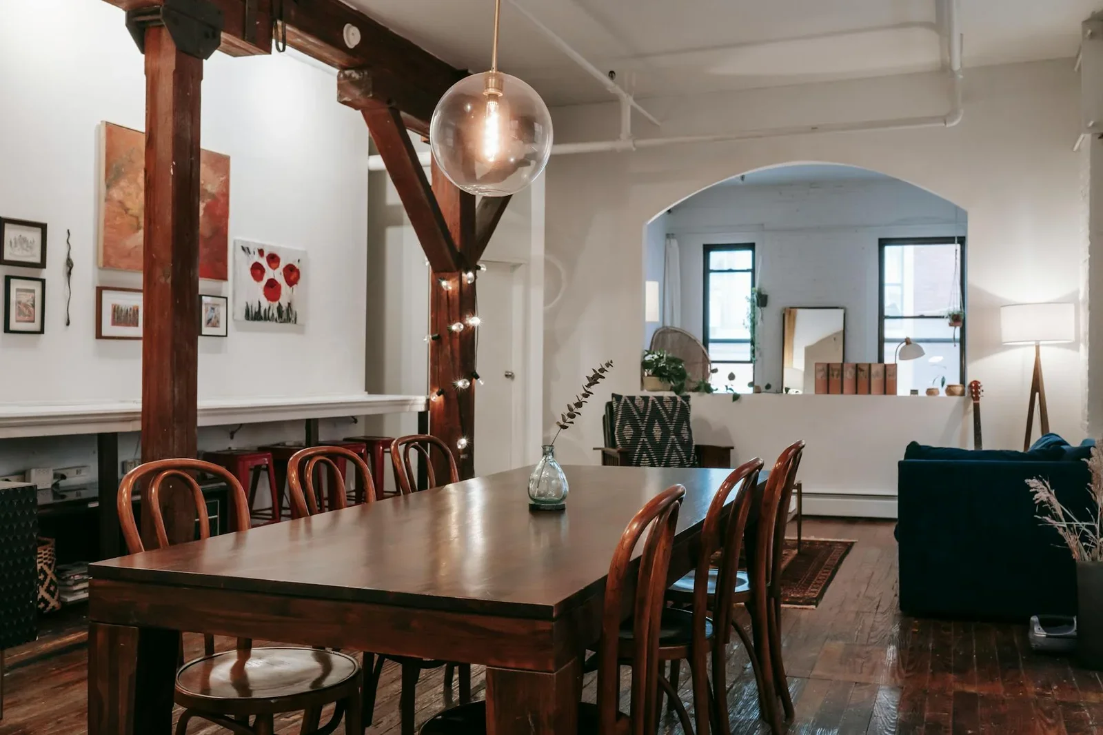 Interior of wooden table with glowing lamps hanging on pilla | Thiết kế nội thất 24
