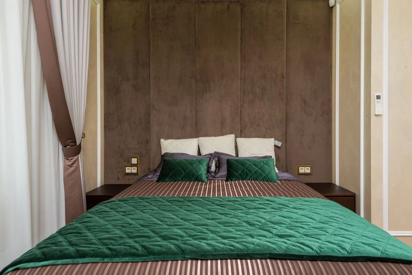 Cozy modern bedroom with green bedding and soft lighting. Id | Thiết kế nội thất 24
