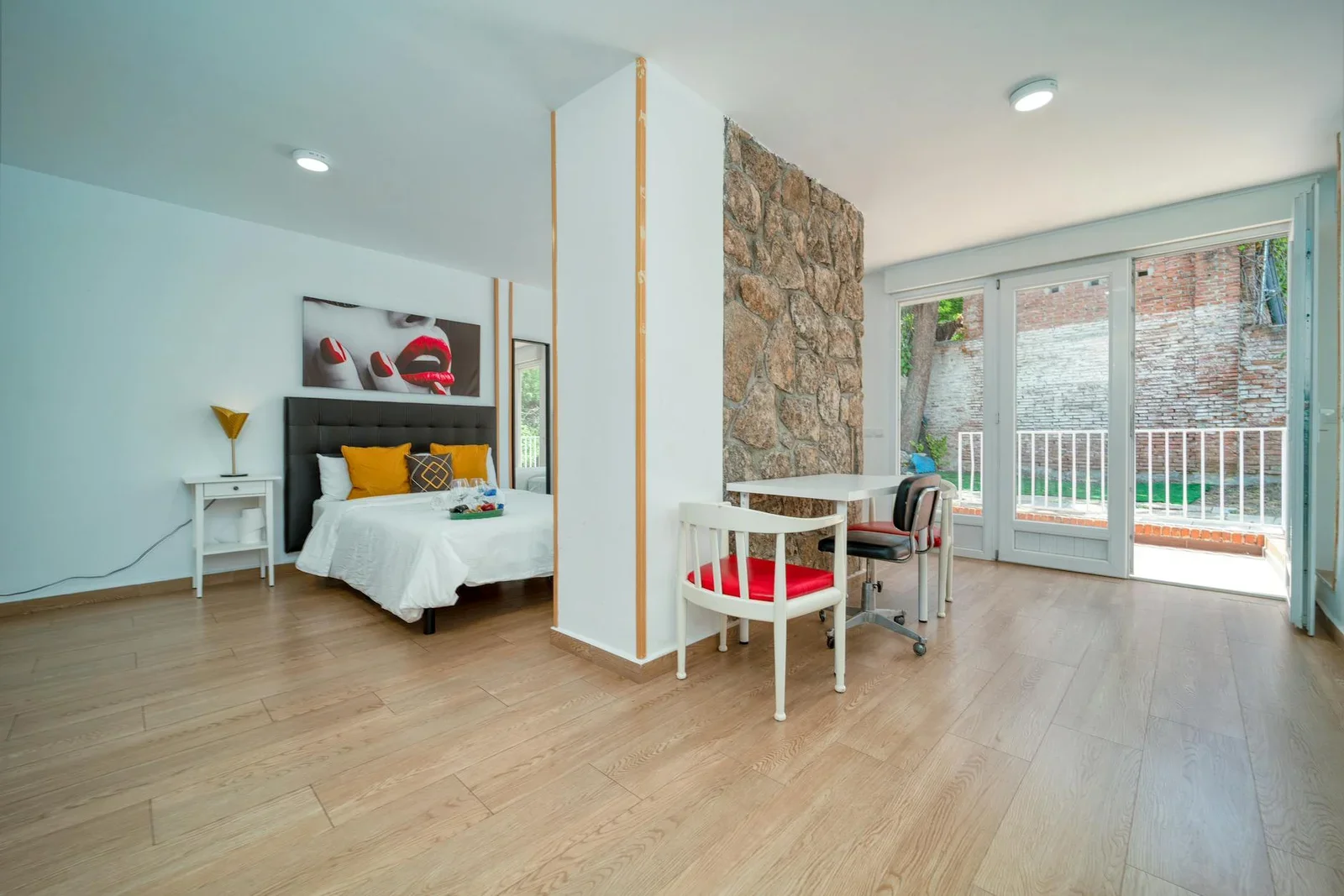 Stylish minimalist bedroom with stone partition and natural  | Thiết kế nội thất 24