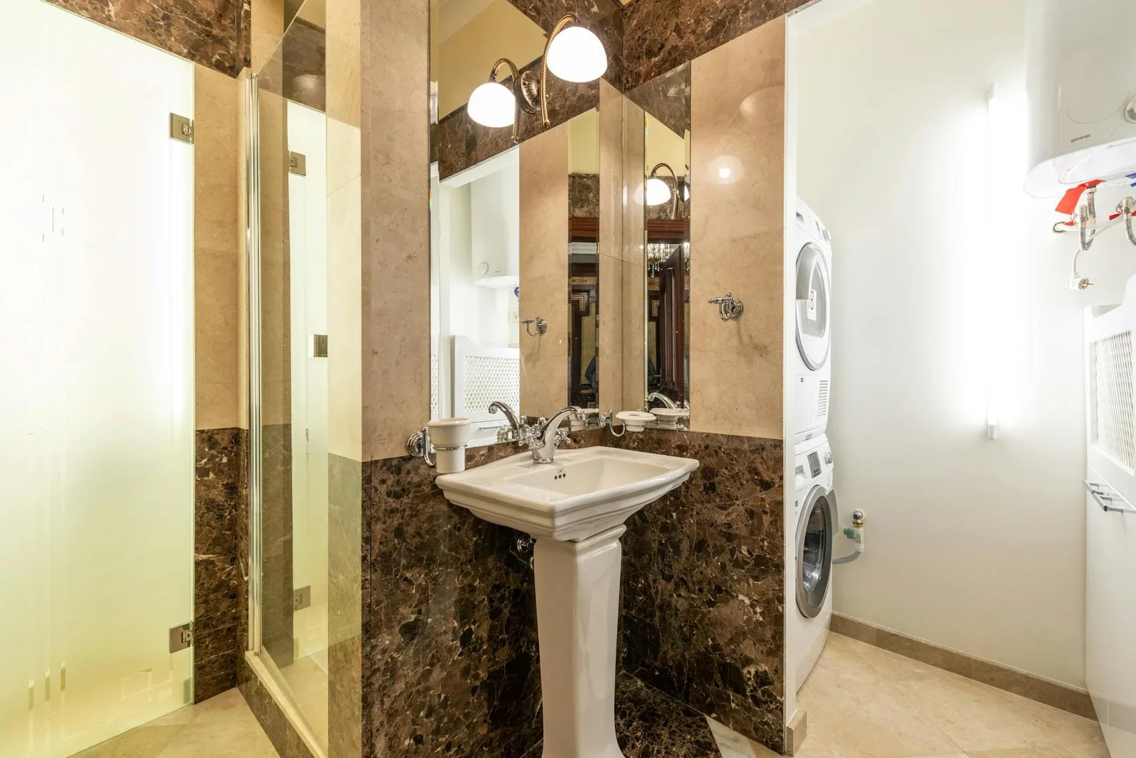 Elegant bathroom interior featuring marble walls, a pedestal | Thiết kế nội thất 24