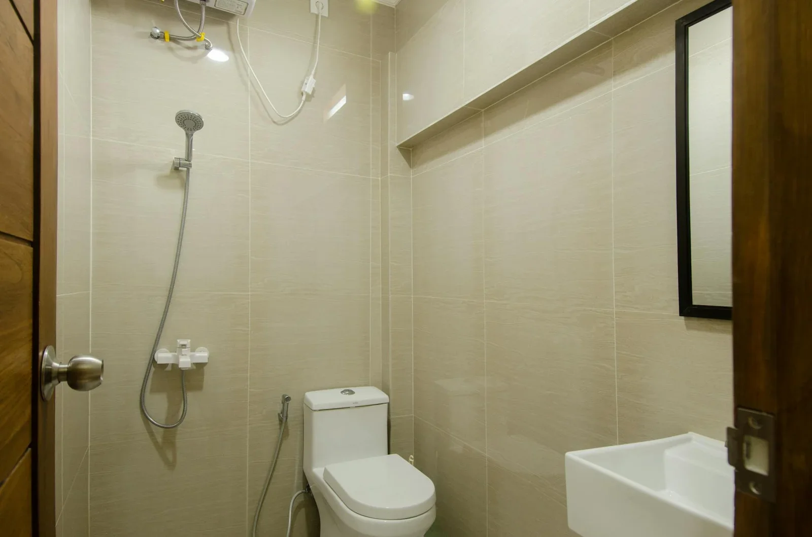 Contemporary bathroom featuring shower, toilet, and sleek mo | Thiết kế nội thất 24