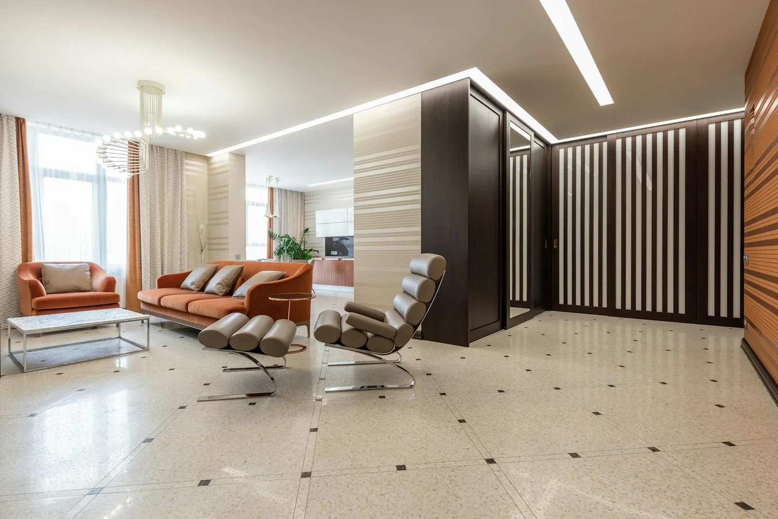 Căn hộ hiện đại sở hữu hành lang rộng thoáng, ghế sofa êm ái và khu bếp liên thông tối ưu diện tích. | Thiết kế nội thất 24