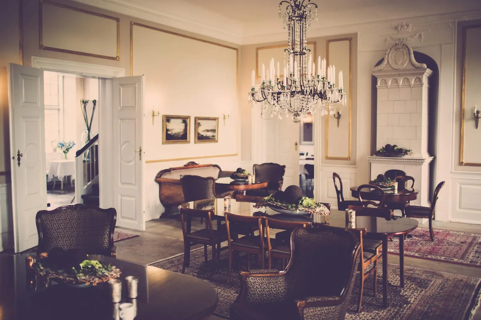 A vintage-style dining room showcasing a grand chandelier an | Thiết kế nội thất 24