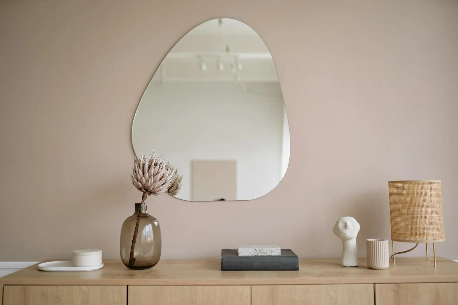 Stylish minimalist interior featuring a mirror, decorative v | Thiết kế nội thất 24