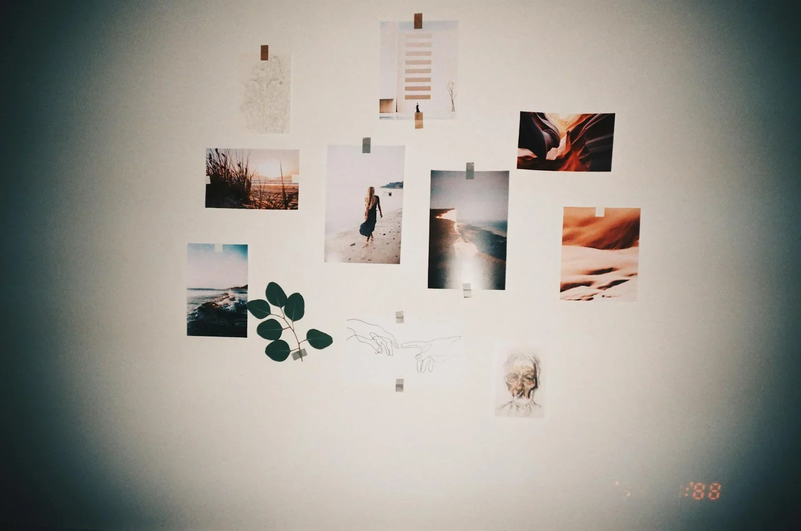 A stylish wall collage featuring photos and art prints taped | Thiết kế nội thất 24
