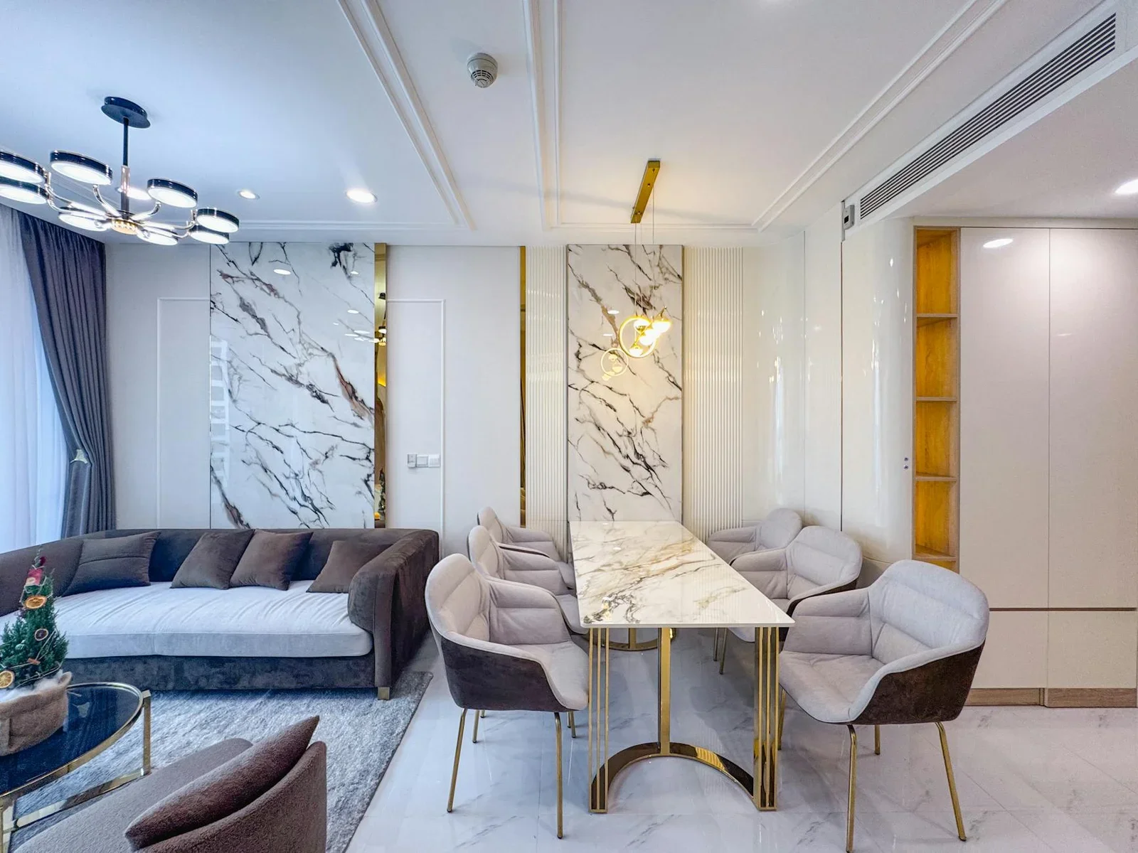 Luxurious living and dining room with marble decor and conte | Thiết kế nội thất 24