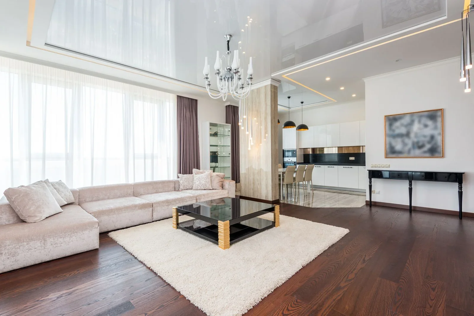 Phòng khách hiện đại rộng rãi nổi bật với đèn chùm nghệ thuật cùng chi tiết ấm cúng, kiến tạo không gian thanh lịch và thư thái. | Thiết kế nội thất 24