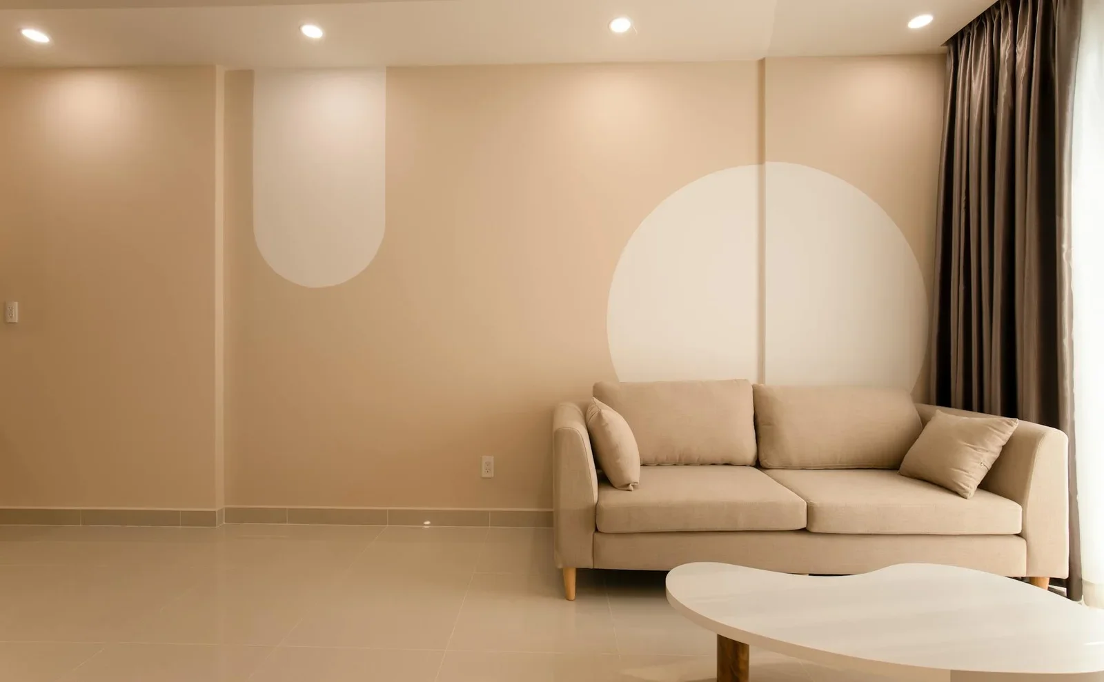 A cozy minimalist living room featuring a beige sofa, modern | Thiết kế nội thất 24