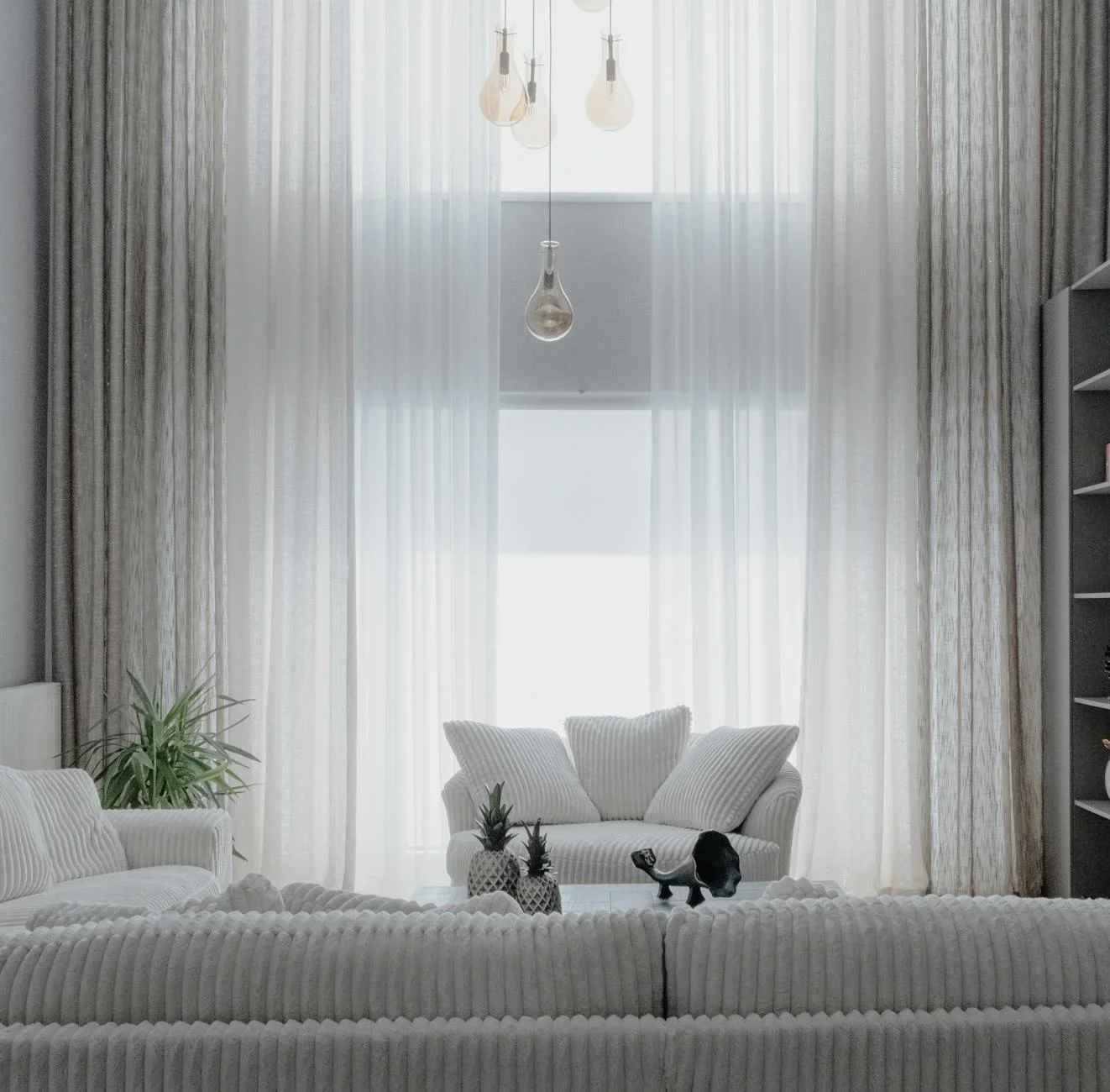 A minimalist living room with soft white sofas and large cur | Thiết kế nội thất 24