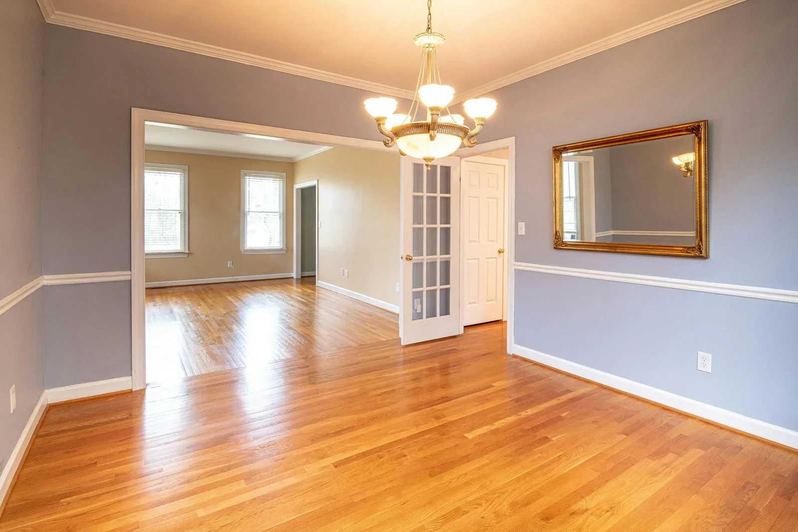 Bright residential room with hardwood floor and chandelier, | Thiết kế nội thất 24