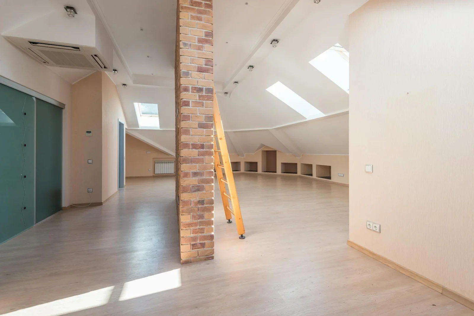 Spacious attic room with natural light from skylights, featu | Thiết kế nội thất 24