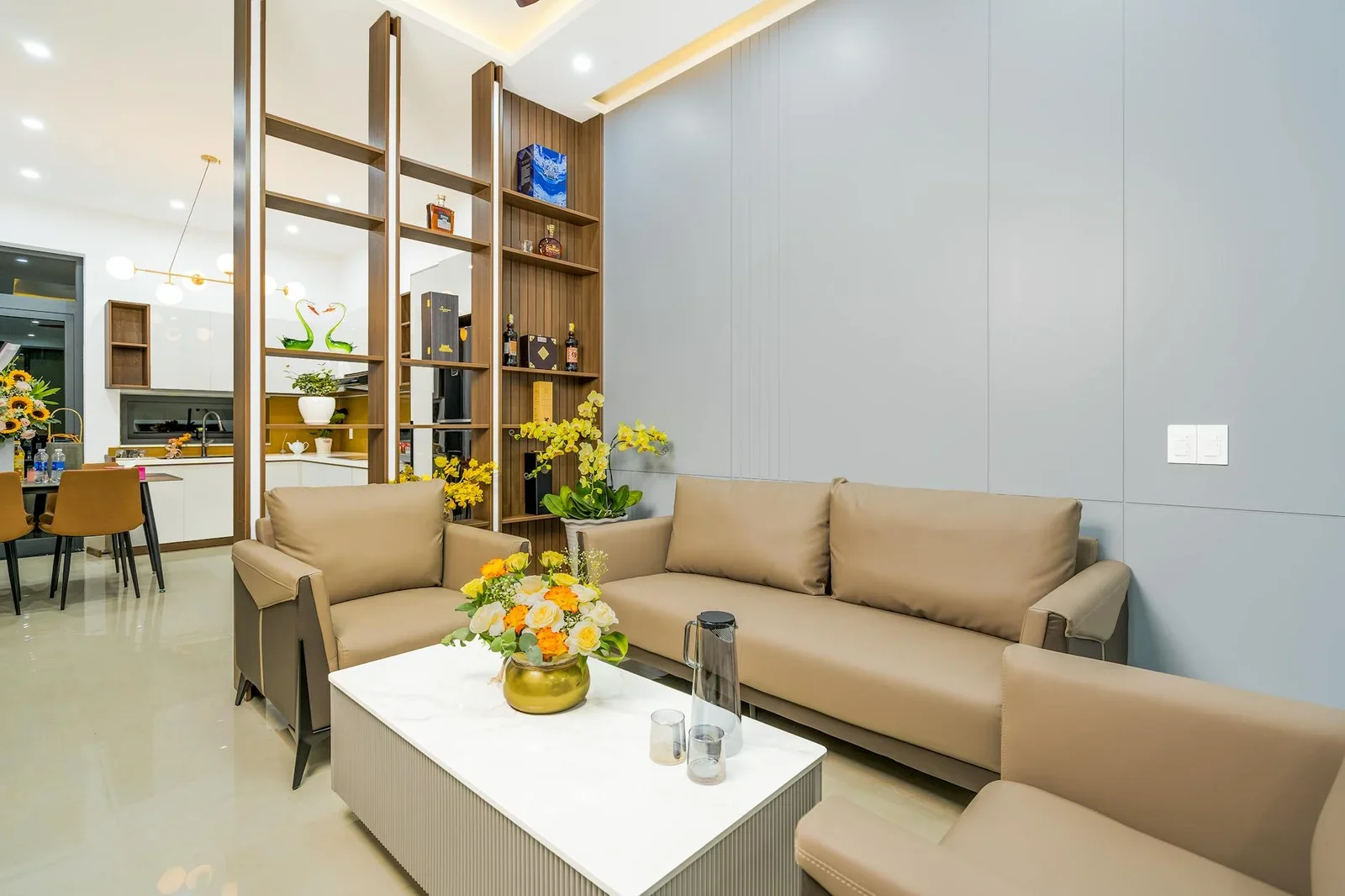 Elegant living room with modern furniture and vibrant flower | Thiết kế nội thất 24