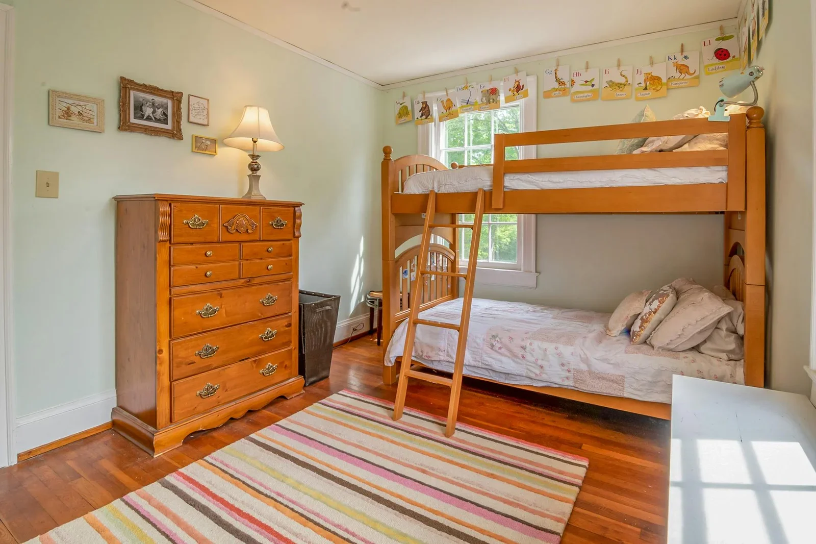 Warm and inviting children's bedroom featuring a classic woo | Thiết kế nội thất 24
