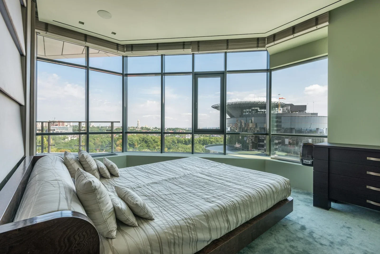 Spacious bedroom with large windows offering a breathtaking | Thiết kế nội thất 24