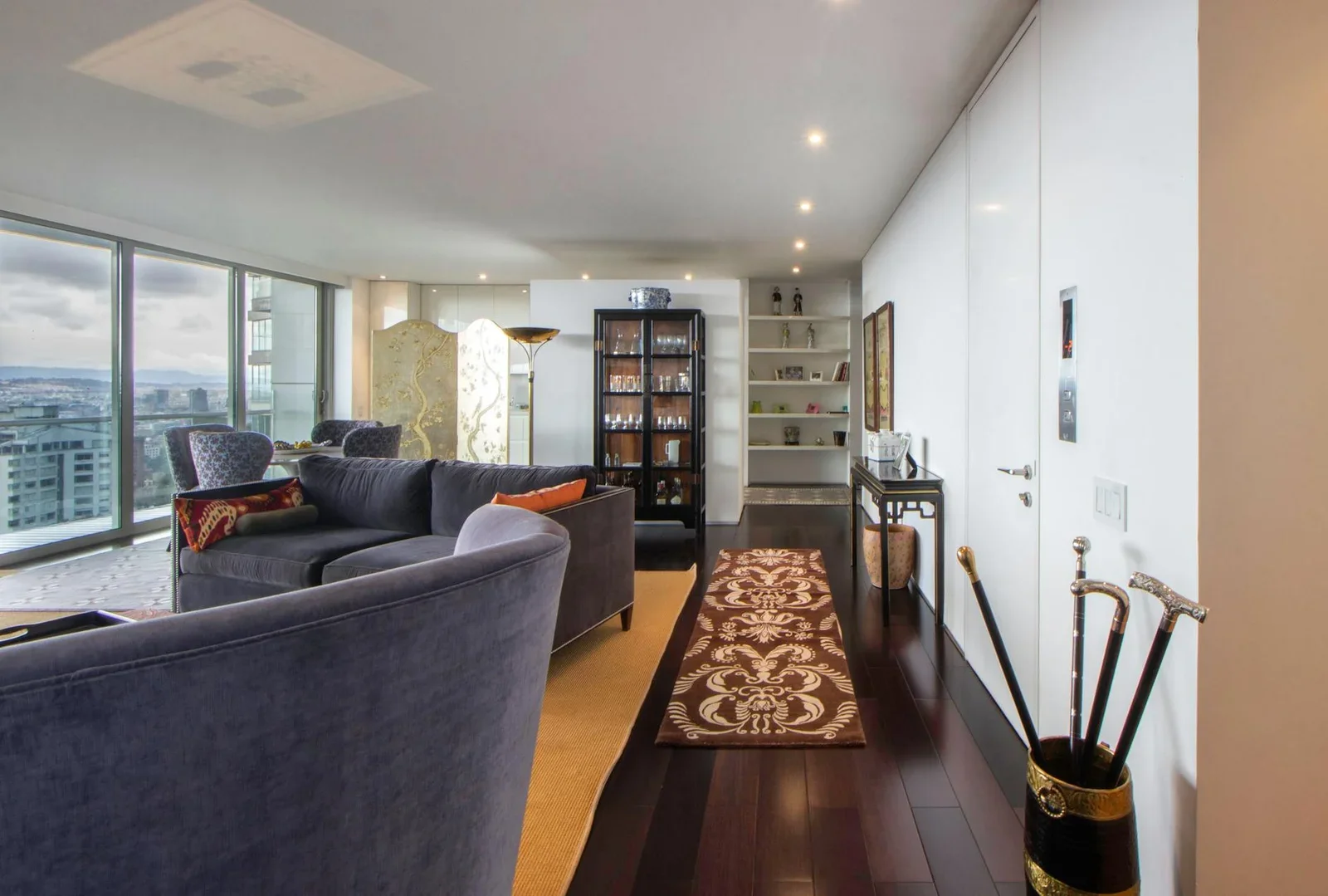 Spacious living room interior with cityscape view, modern fu | Thiết kế nội thất 24